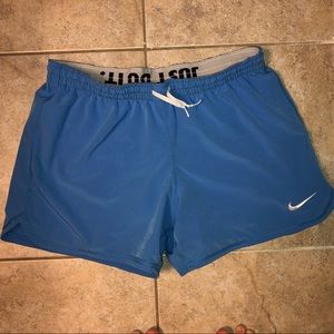 Nike blue shorts with white spandex